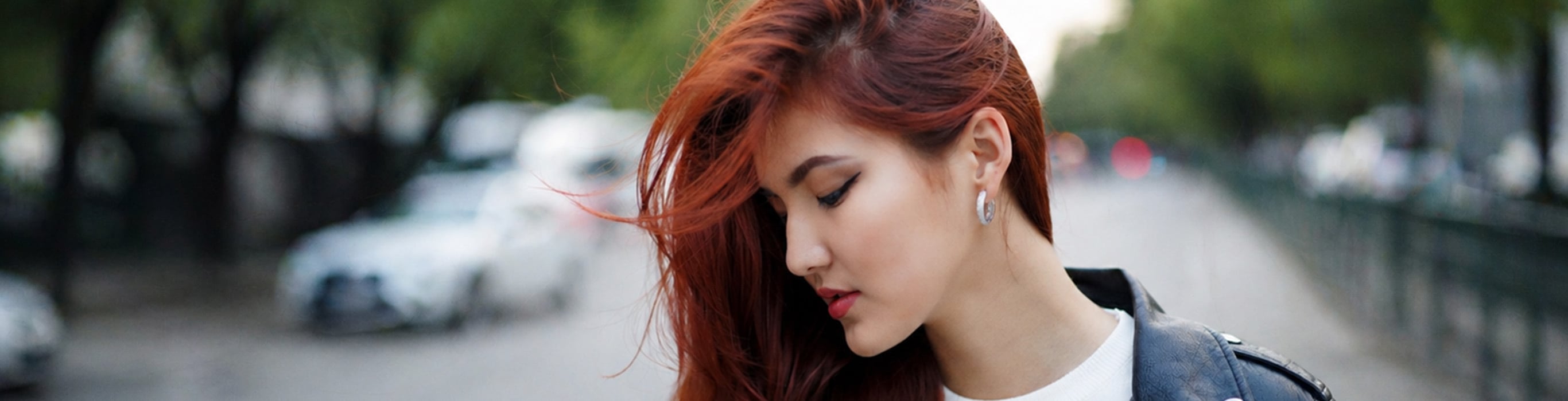 Woman with fine, healthy-looking hair styled to create the appearance of fuller volume.